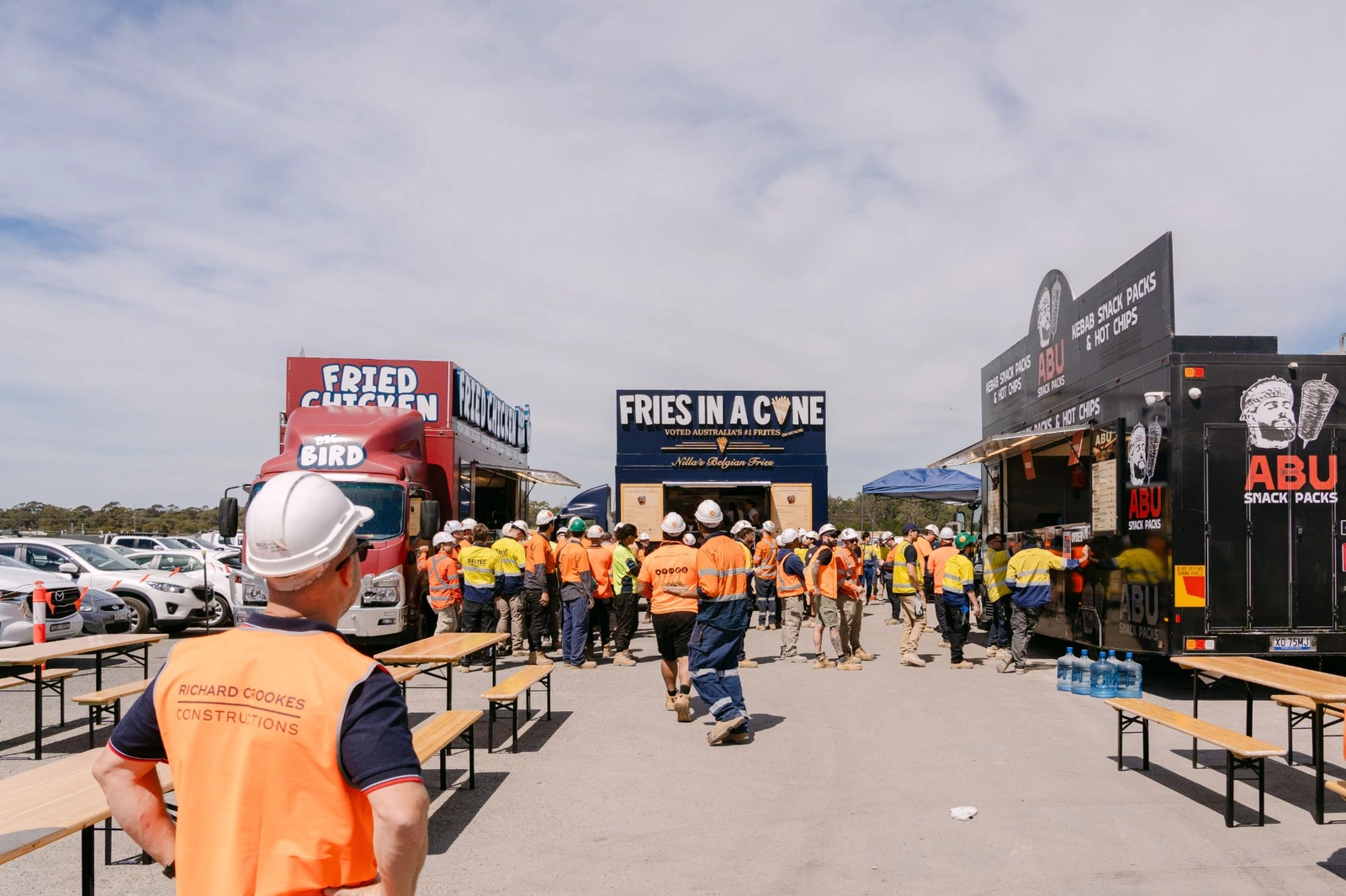 Three Food Hub trucks, Birdman fried chicken, Nillas Belgian fries and Abu Snack Packs, serving workers in hi vis at the Vanderlande, Kmart and Richard Crookes site lunch in Moorebank